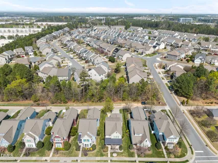 an aerial view of residential houses with outdoor space