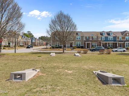 a swimming pool with outdoor seating and yard