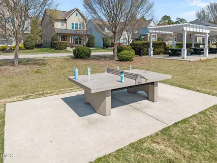 a view of a house with pool and yard