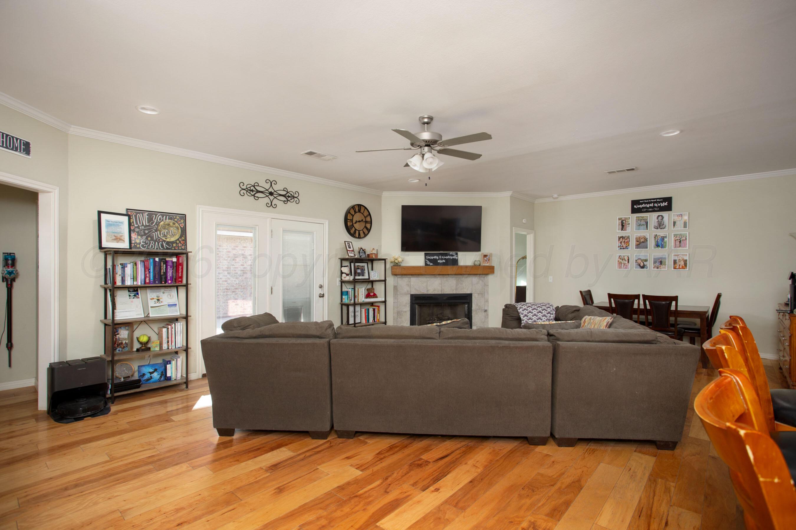 9505 Perry Avenue Amarillo, TX 79119 - Photo 5 of 21 a living room with furniture and a flat screen tv