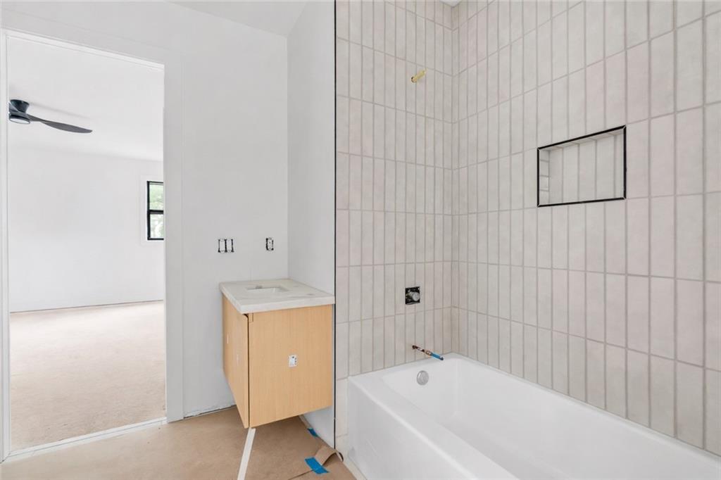 2659 Flat Shoals Road Decatur, GA 30034 - Photo 16 of 19 a bathroom with a bathtub and a shower