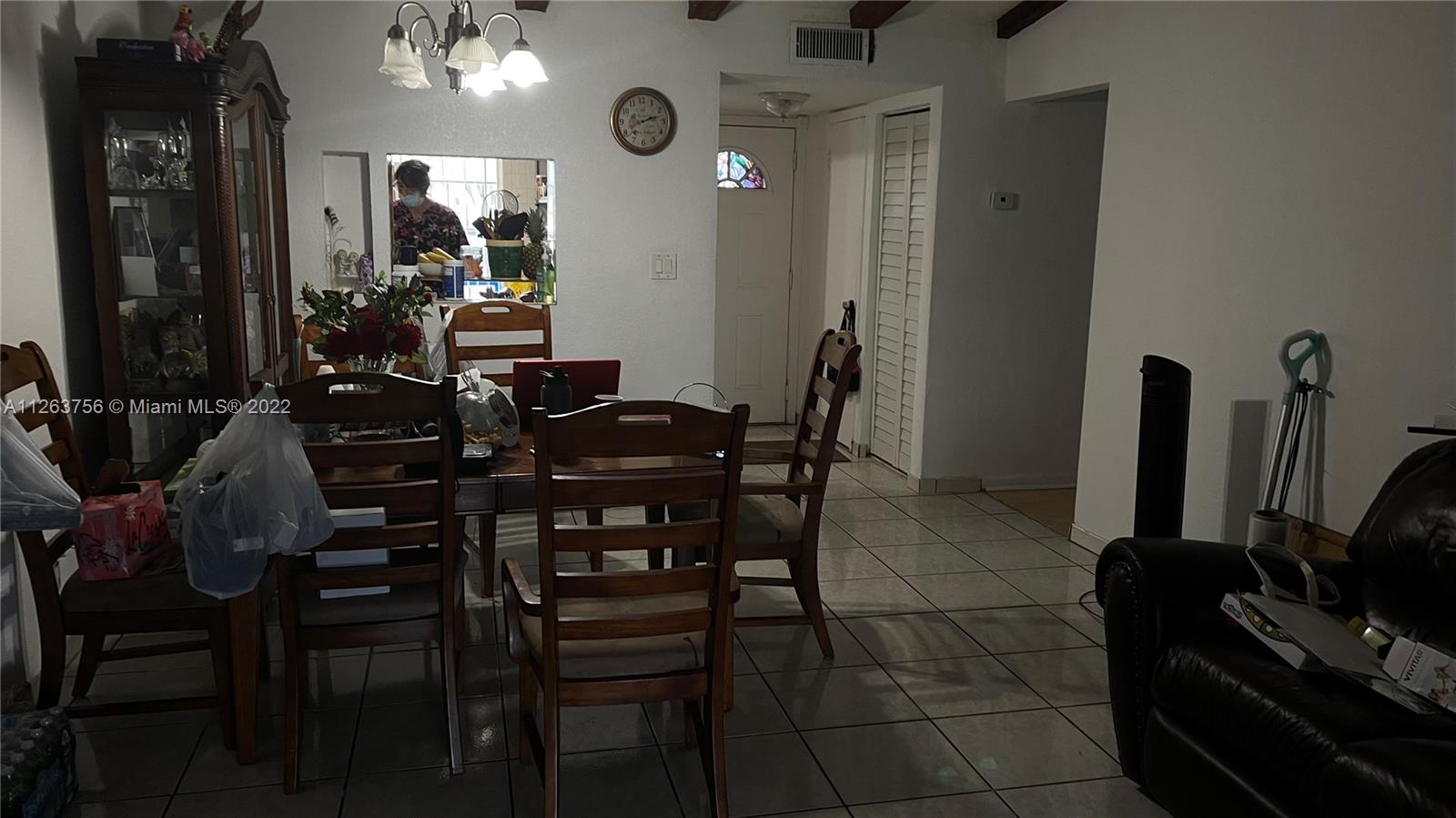 12104 Southwest 110th St Circle South Miami, FL 33186 - Photo 3 of 8 a view of a dining room with furniture and a large window