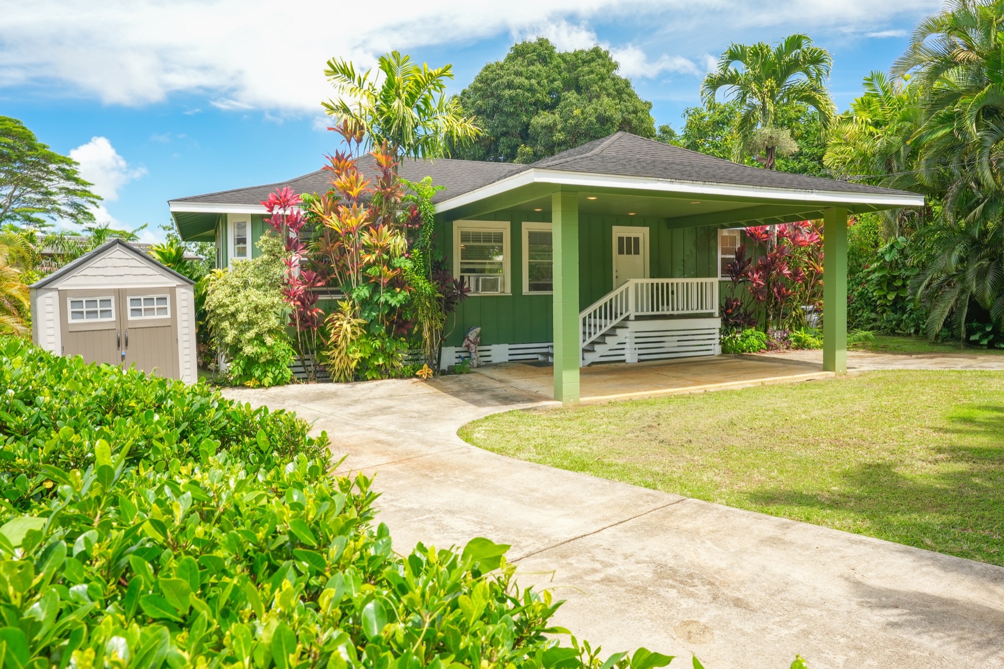 a front view of a house with garden