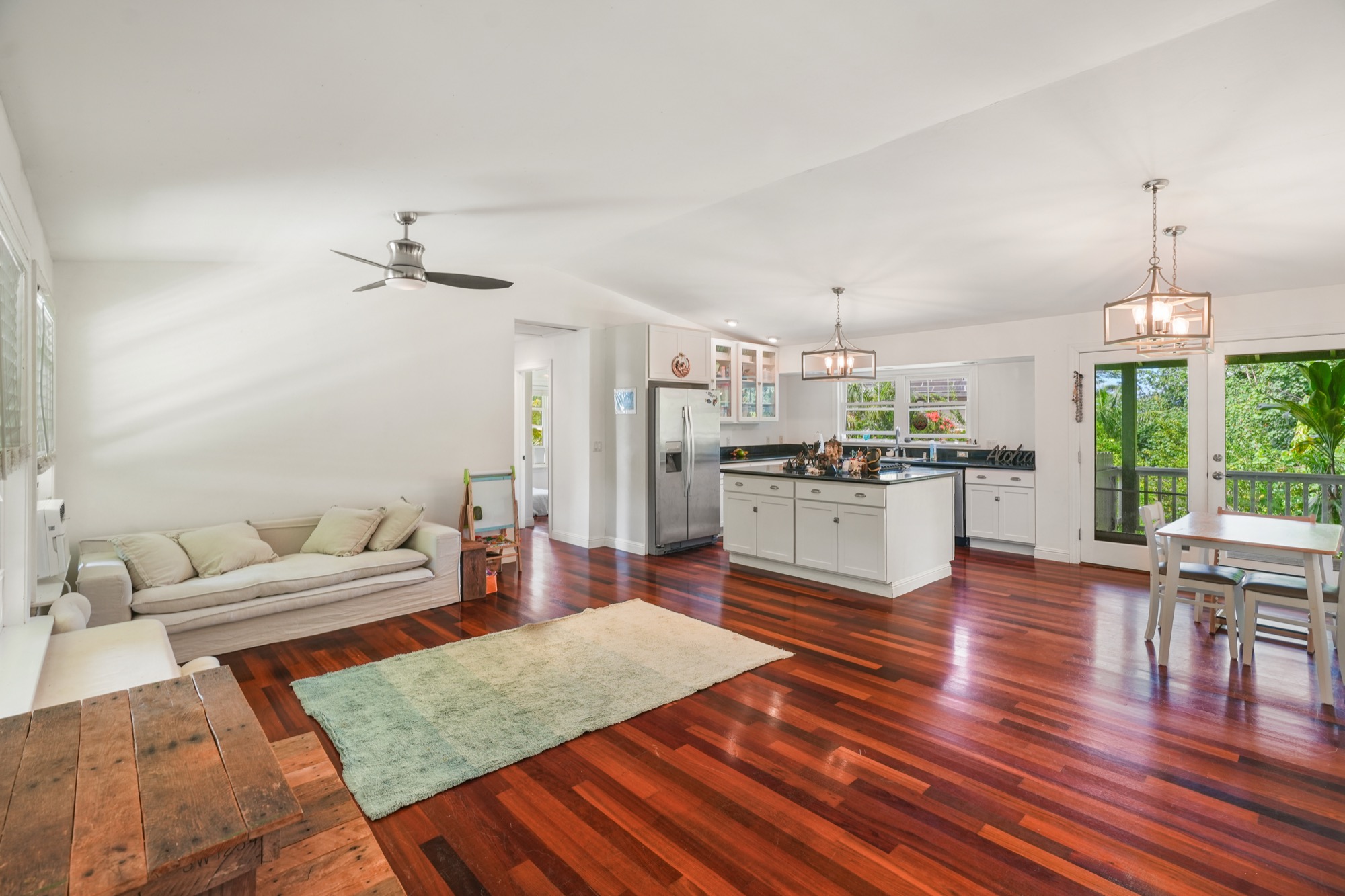 5974 Lokelani Road Kapaa, HI 96746 - Photo 2 of 24 a living room with furniture and kitchen view