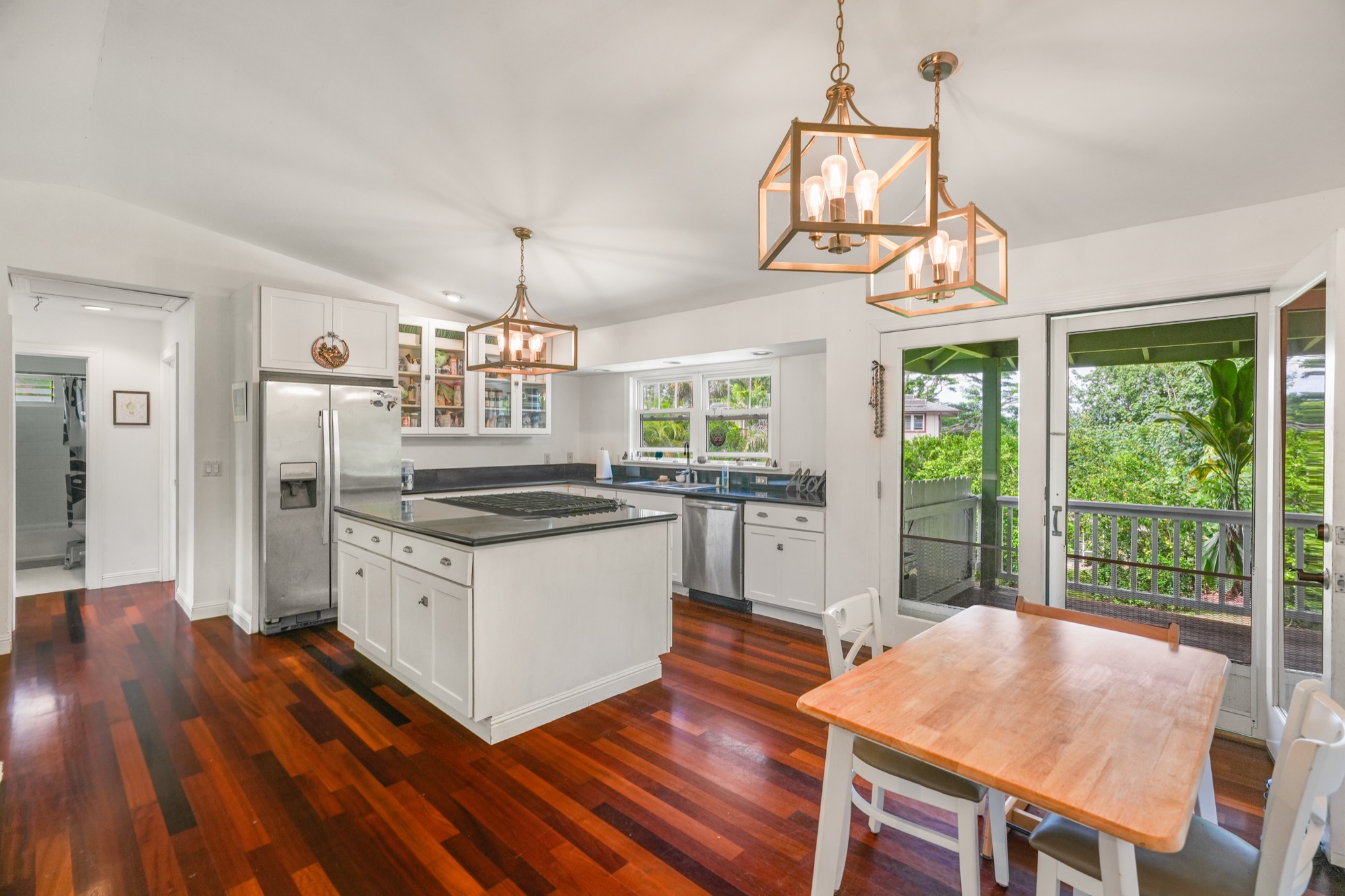 5974 Lokelani Road Kapaa, HI 96746 - Photo 3 of 24 a kitchen with stainless steel appliances granite countertop a stove and a refrigerator