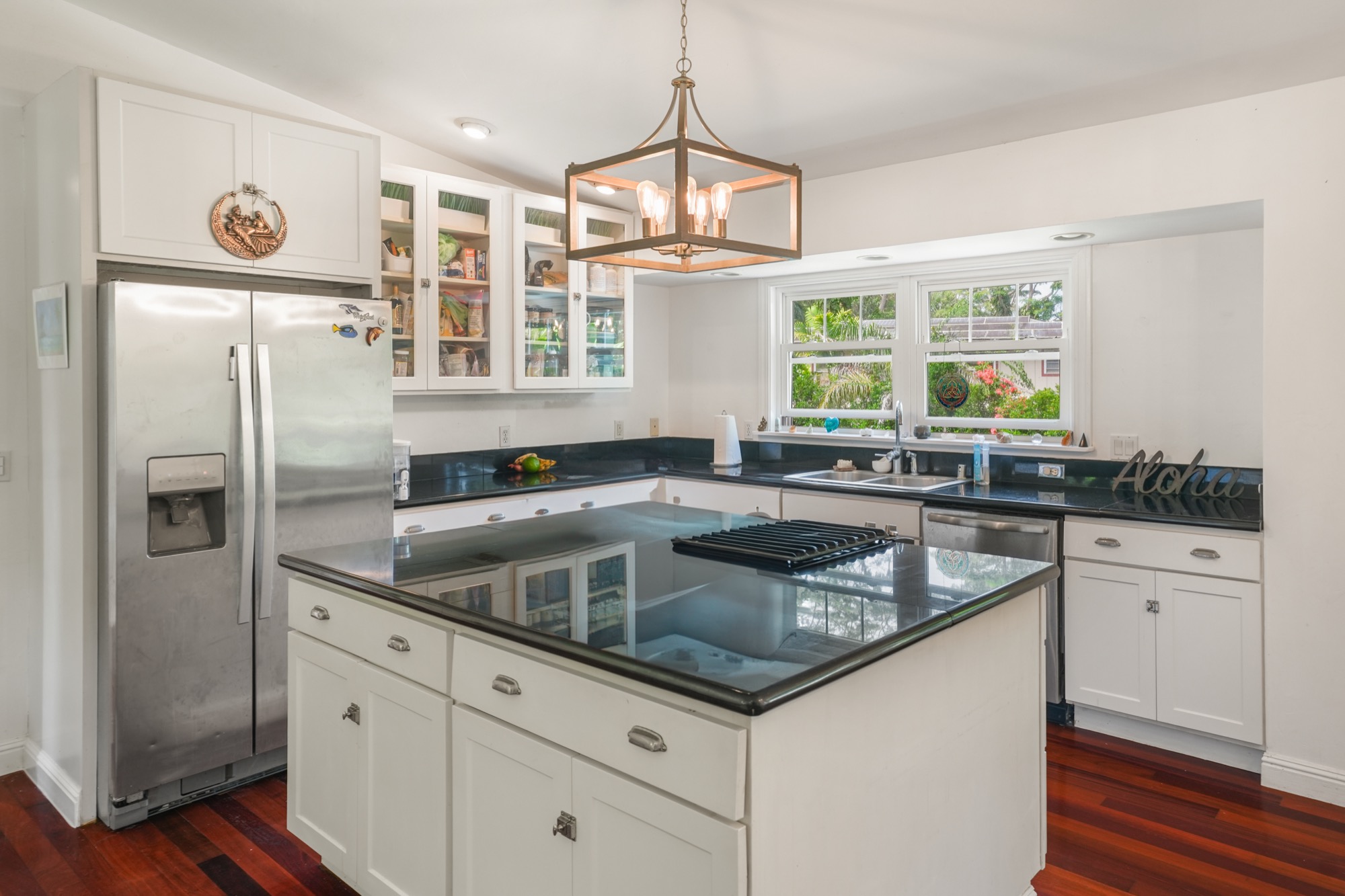 5974 Lokelani Road Kapaa, HI 96746 - Photo 4 of 24 a kitchen with a refrigerator and a sink