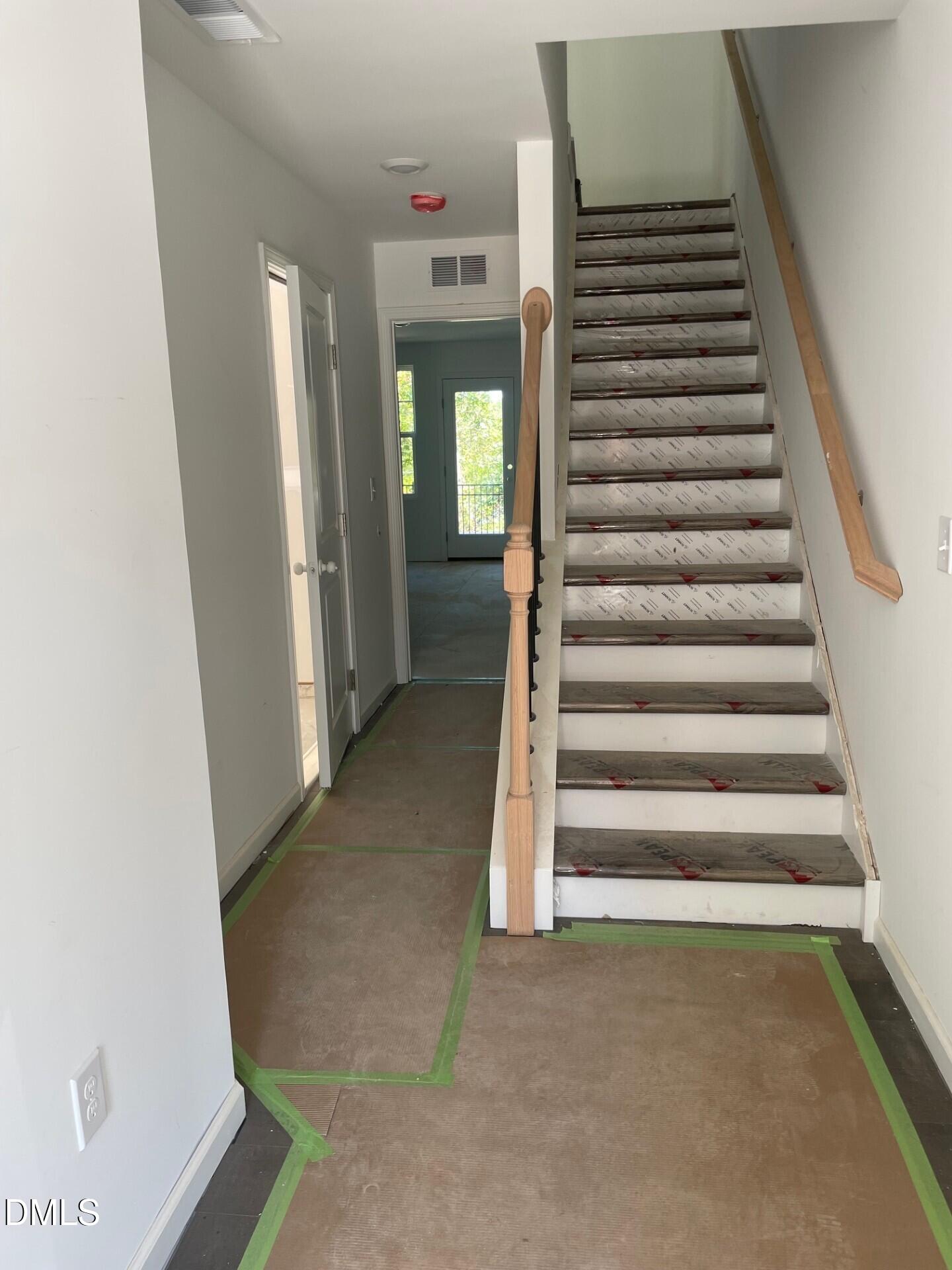 3701 Elm Grv Lane Raleigh, NC 27604 - Photo 8 of 30 a view of a hallway with stairs and door