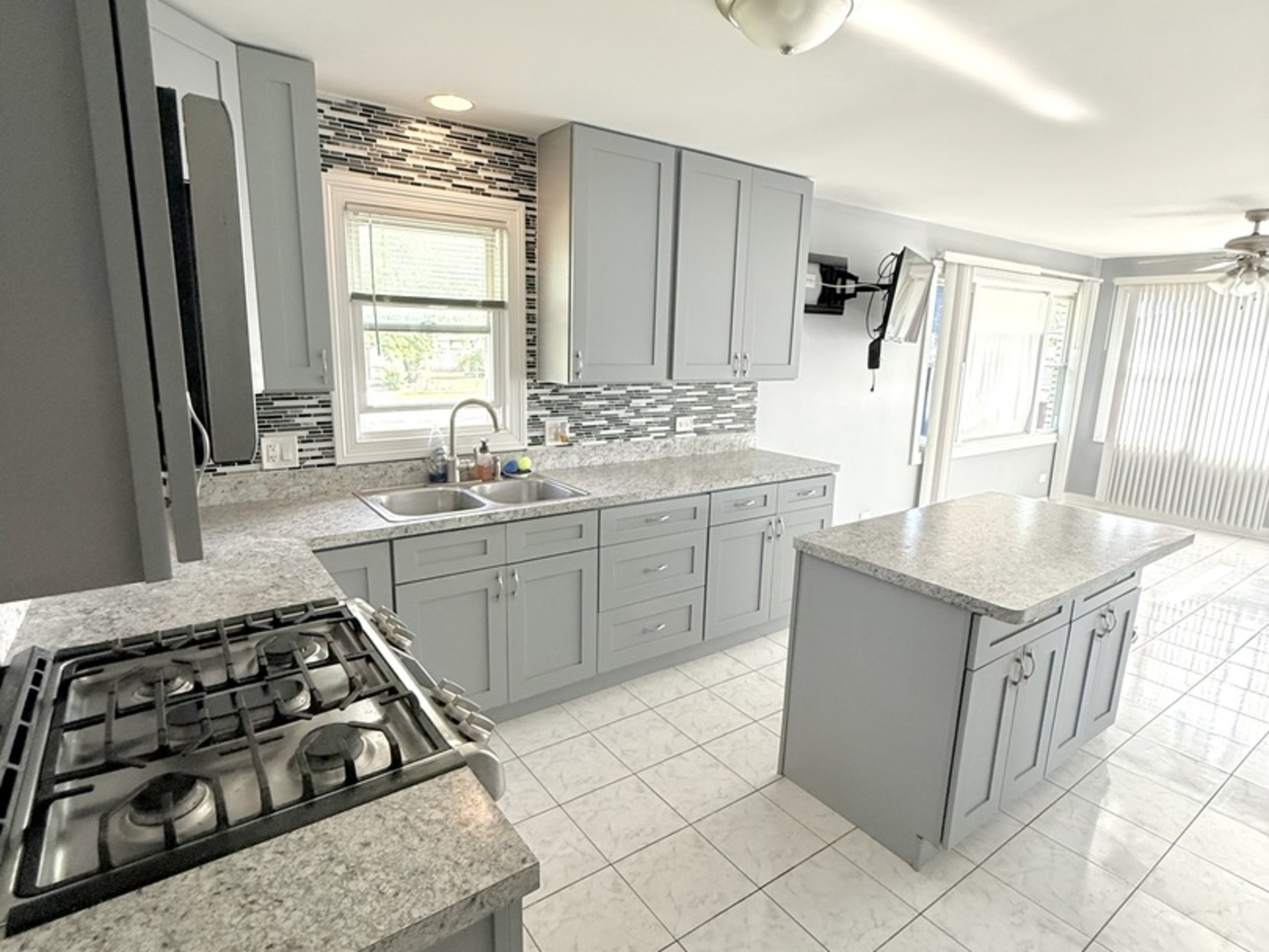 8356 South 78th Avenue Bridgeview, IL 60455 - Photo 14 of 39 a kitchen with stainless steel appliances a sink stove and cabinets