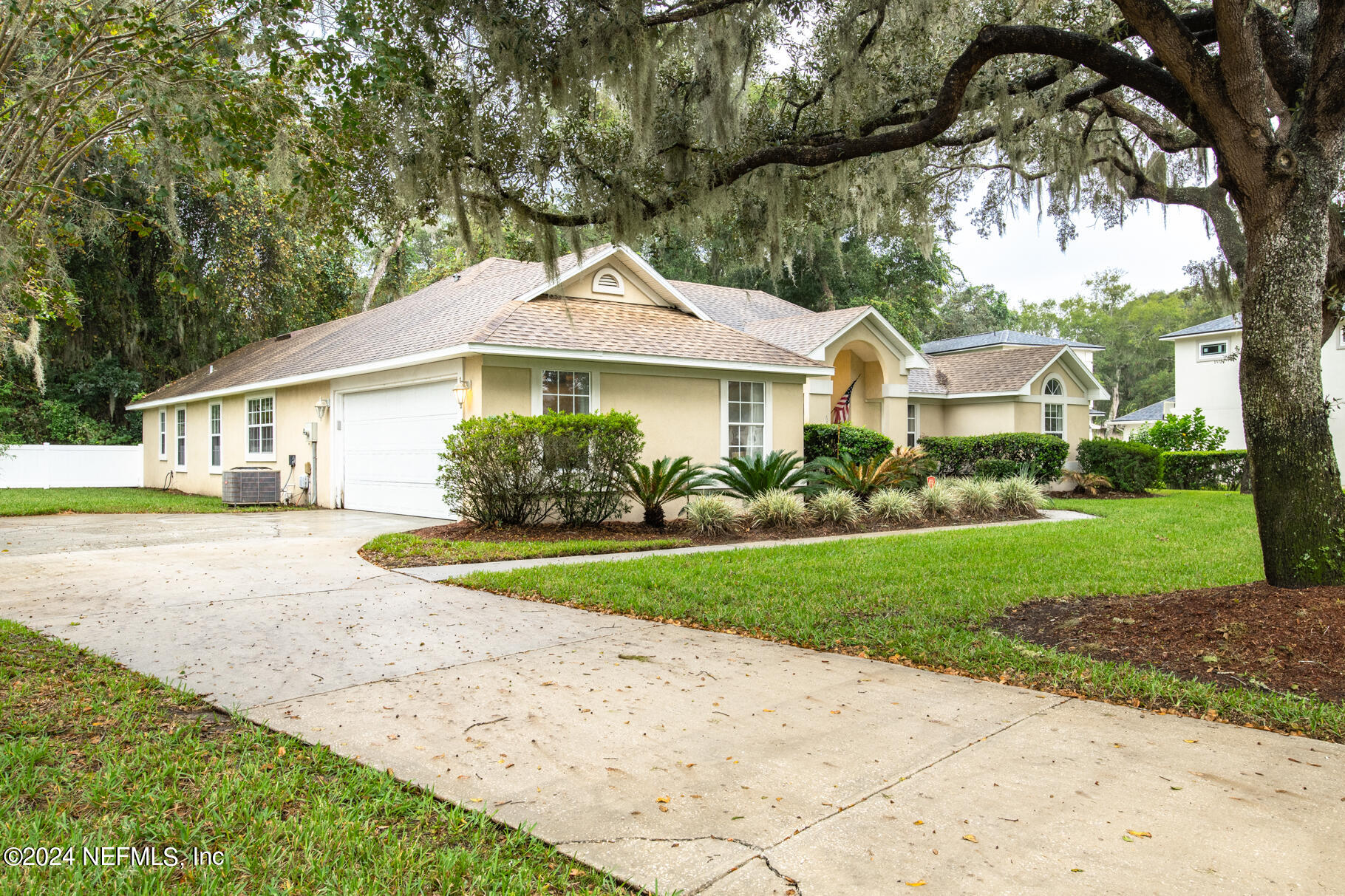 697 Standish Drive St. Augustine, FL 32086 - Photo 11 of 45 a front view of a house with garden