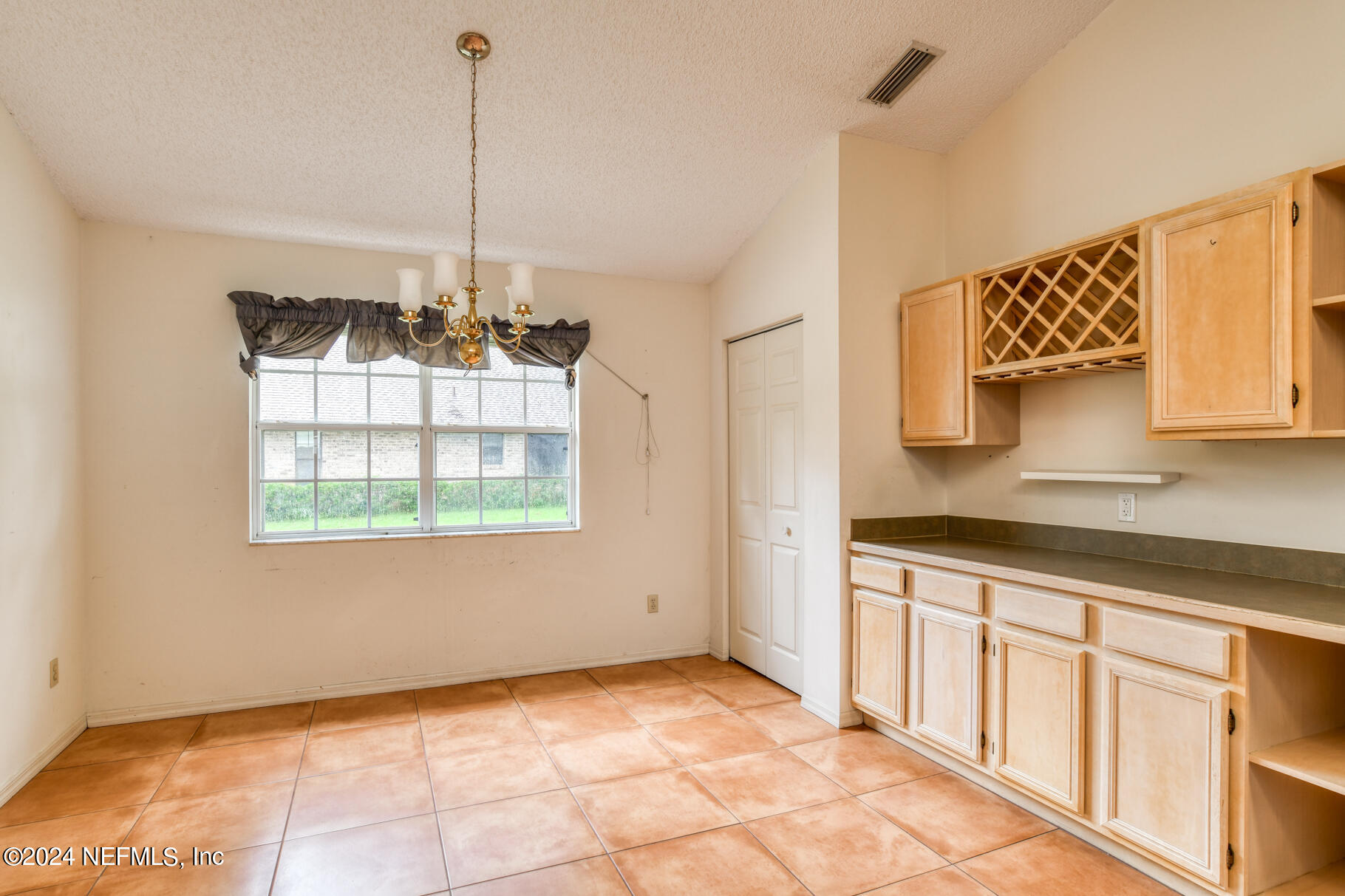 697 Standish Drive St. Augustine, FL 32086 - Photo 19 of 45 a view of a kitchen with a sink cabinets and a window