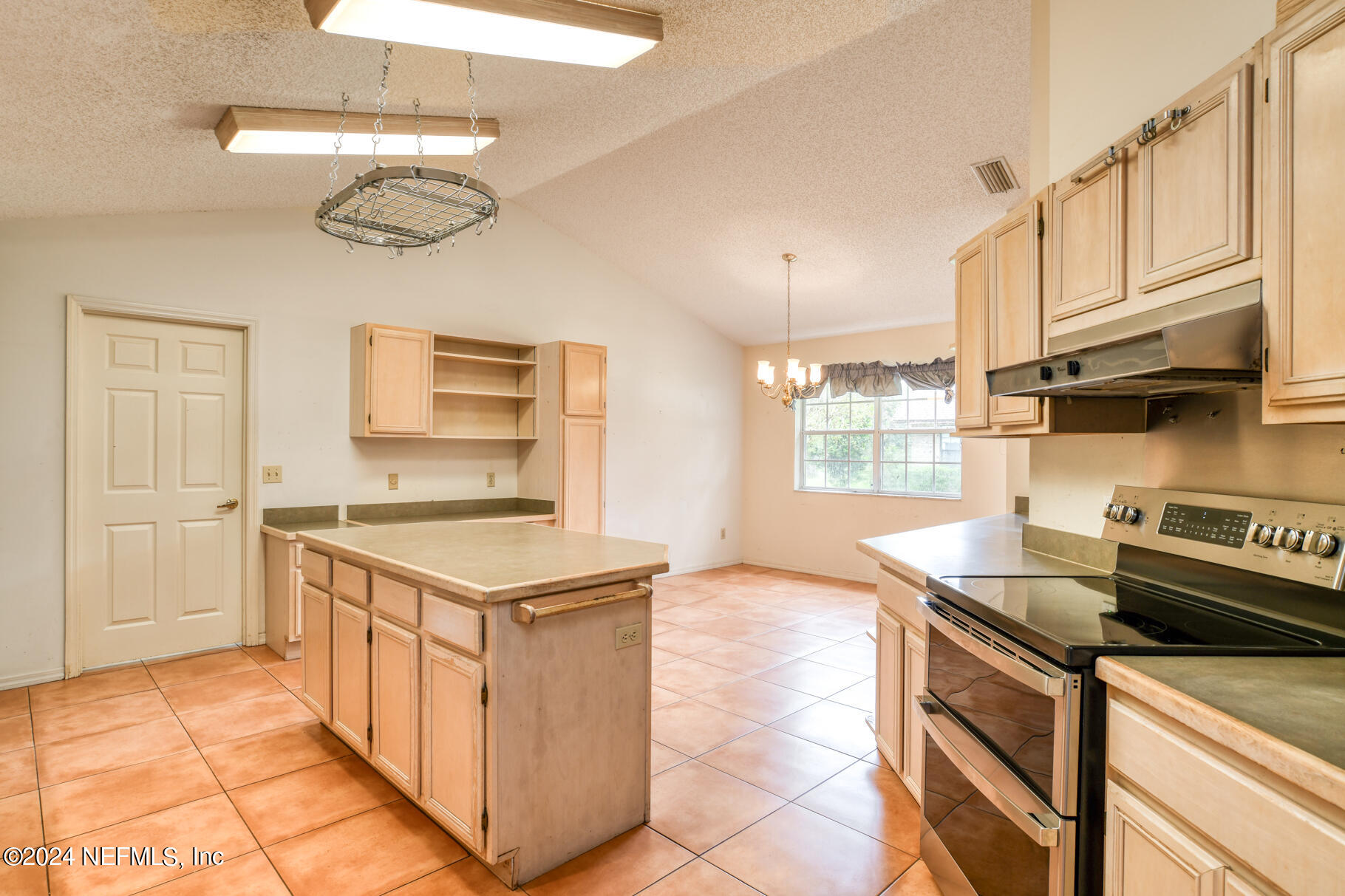 697 Standish Drive St. Augustine, FL 32086 - Photo 20 of 45 a kitchen with stainless steel appliances granite countertop a stove and a sink
