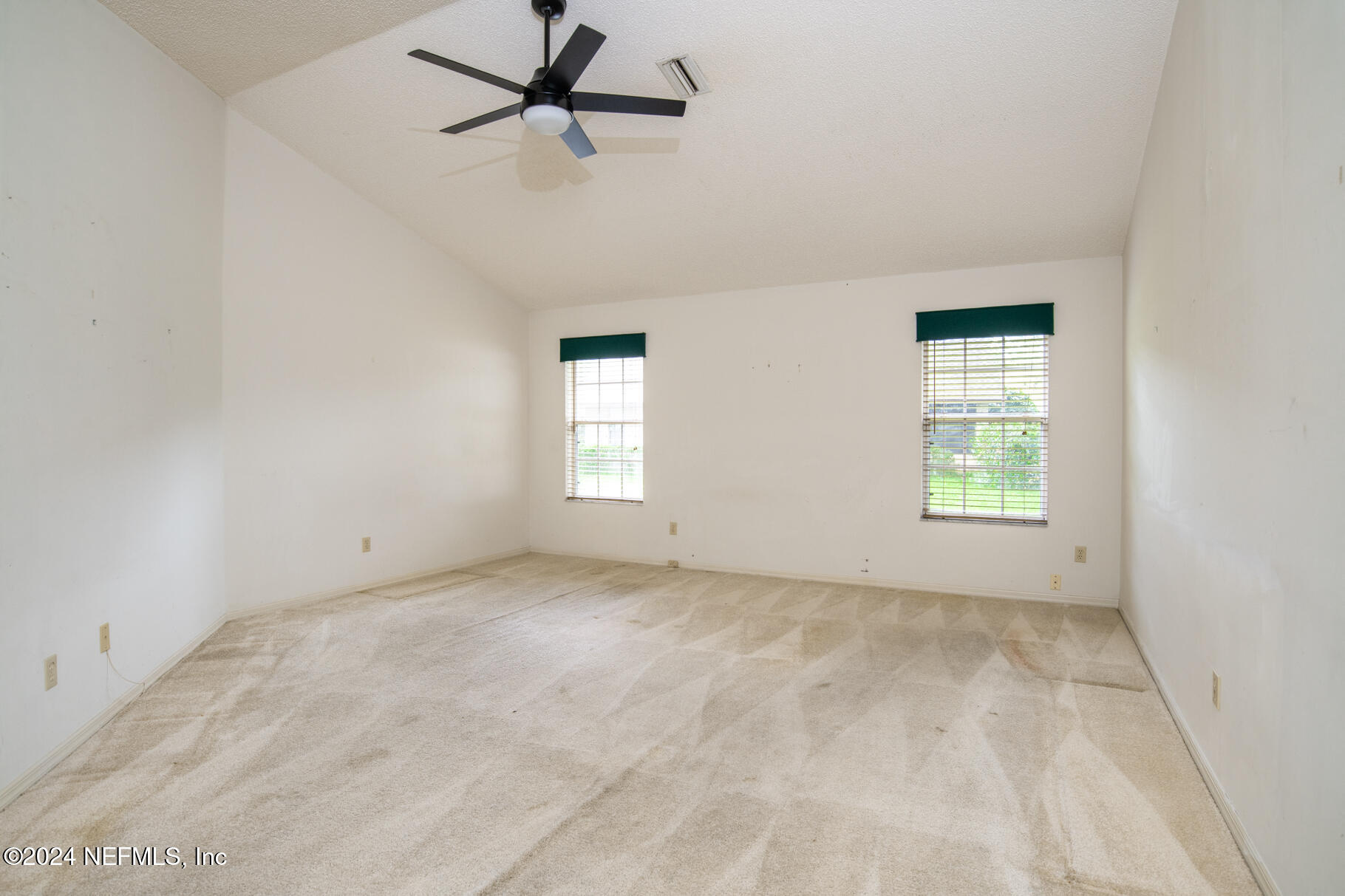 697 Standish Drive St. Augustine, FL 32086 - Photo 25 of 45 a view of empty room with windows