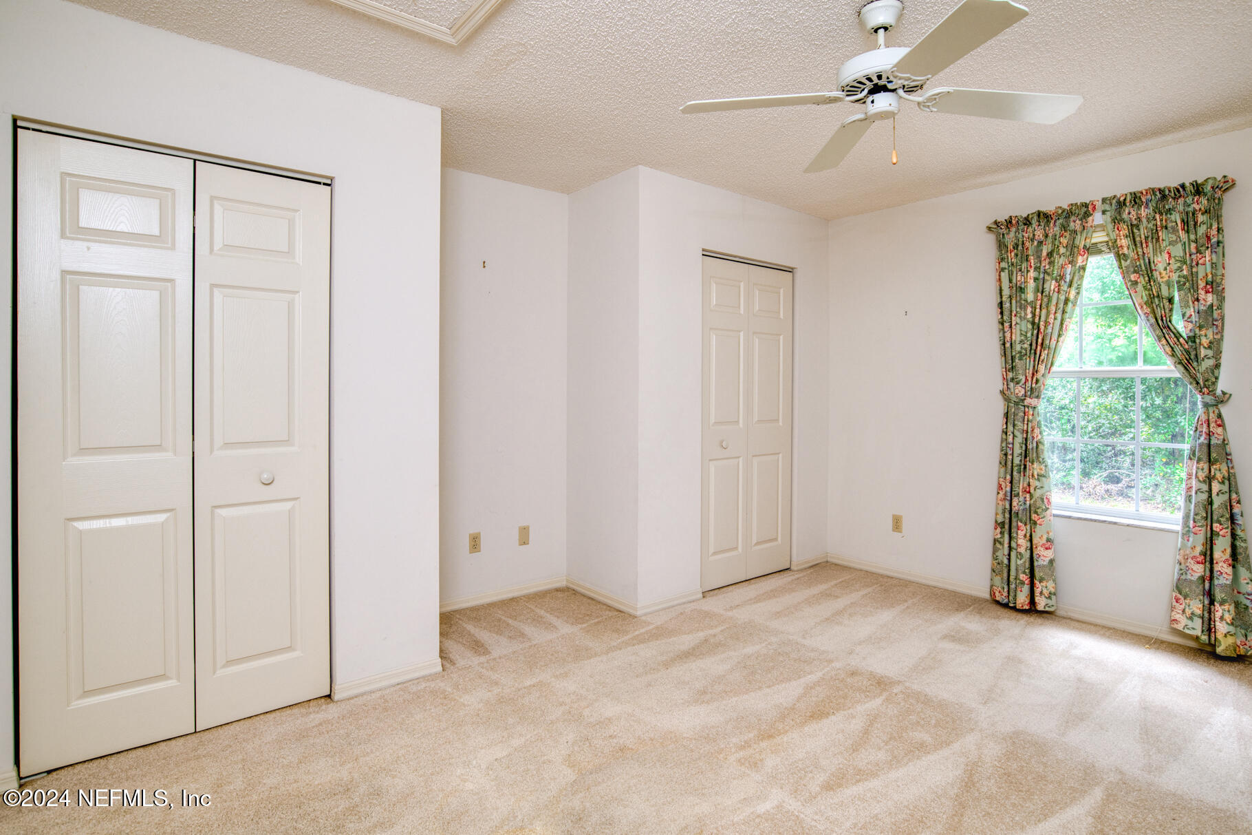 697 Standish Drive St. Augustine, FL 32086 - Photo 29 of 45 an empty room with windows and closet