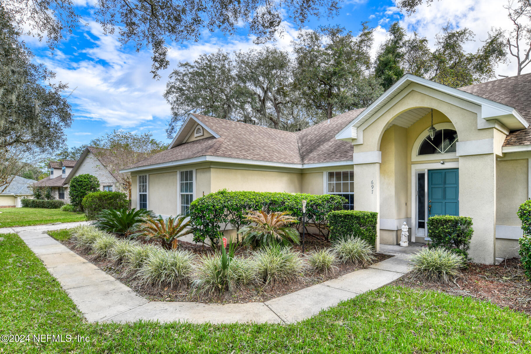 697 Standish Drive St. Augustine, FL 32086 - Photo 37 of 45 a front view of house with yard and green space