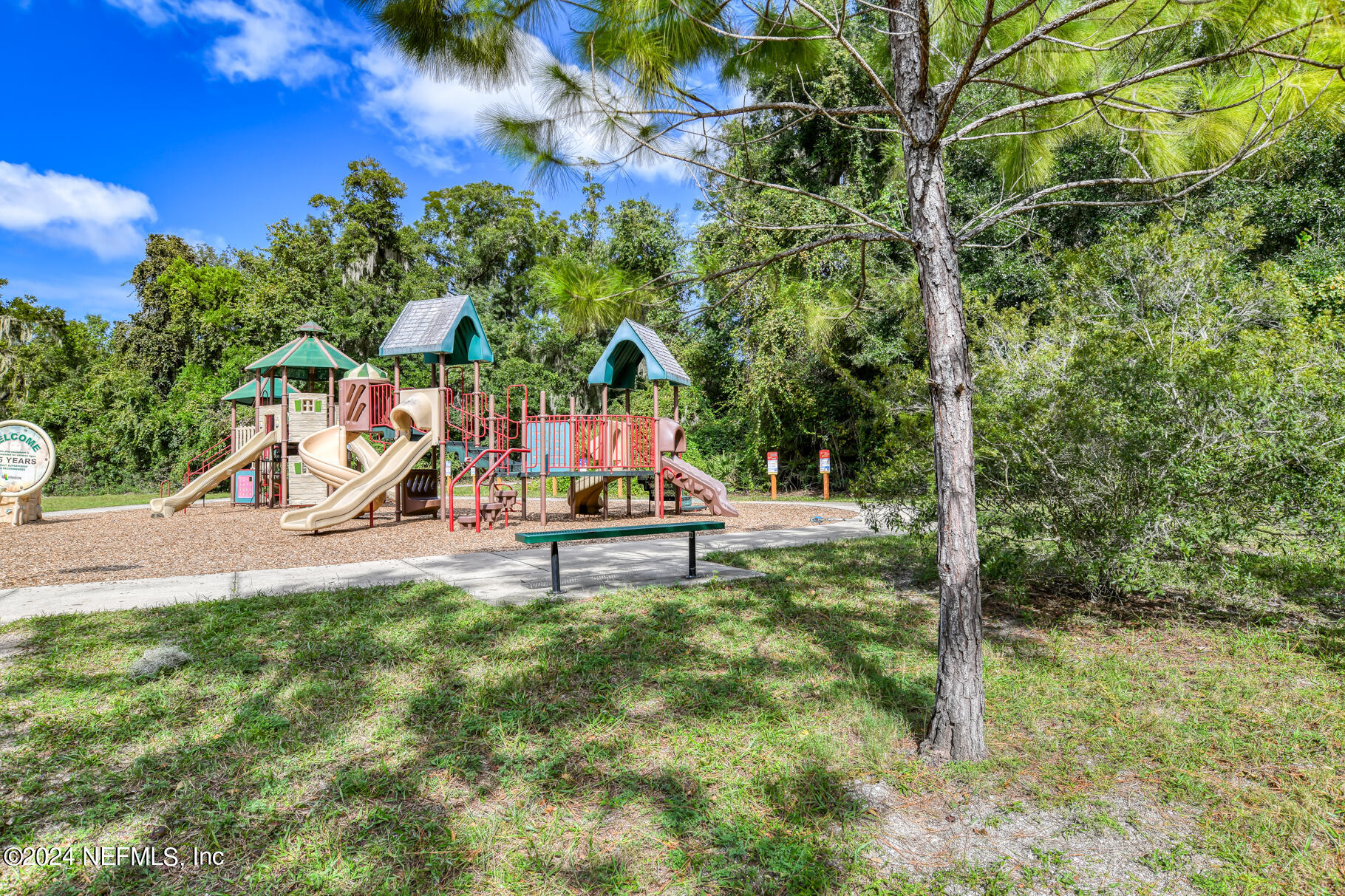 697 Standish Drive St. Augustine, FL 32086 - Photo 39 of 45 a park view with a bench