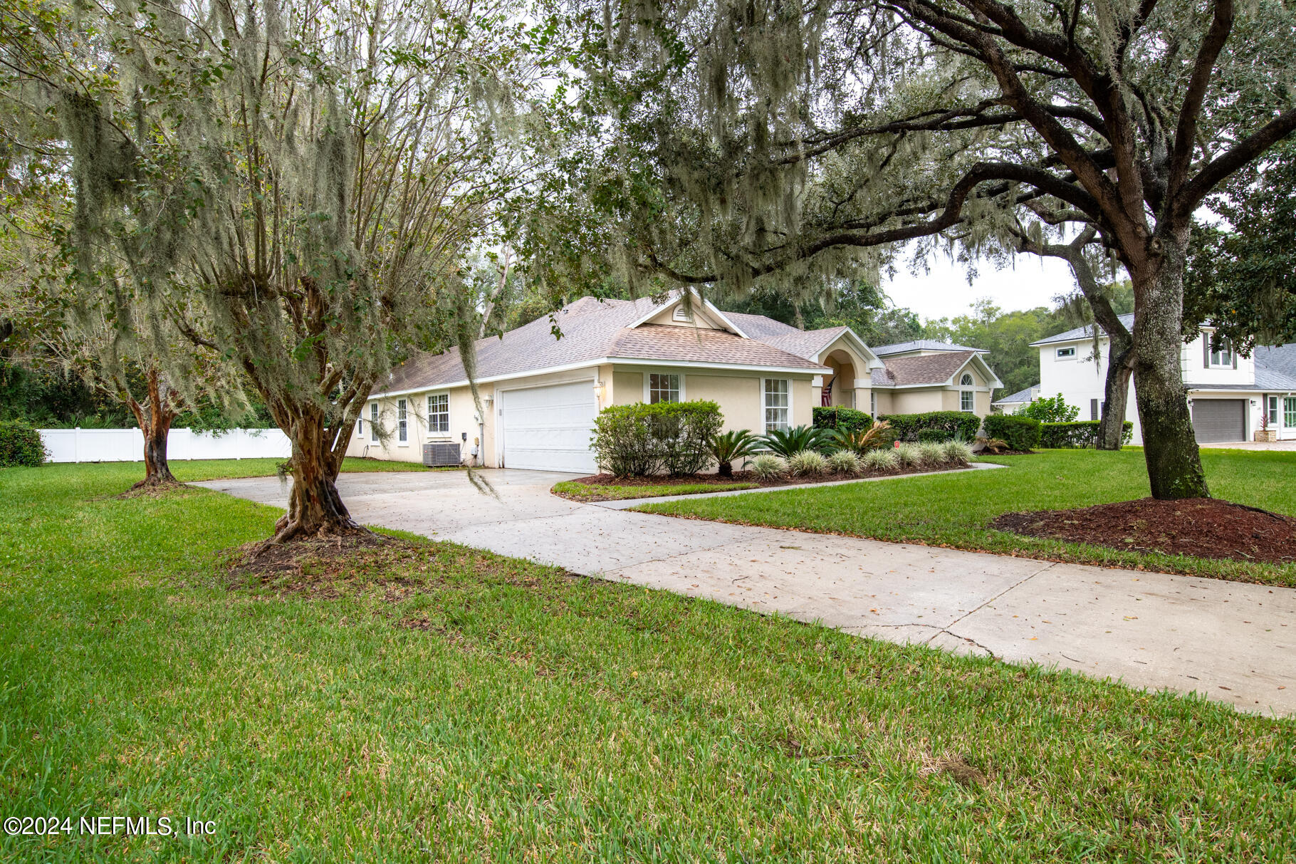 697 Standish Drive St. Augustine, FL 32086 - Photo 10 of 45 a front view of a house with a yard