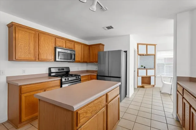 a kitchen with a sink and a refrigerator