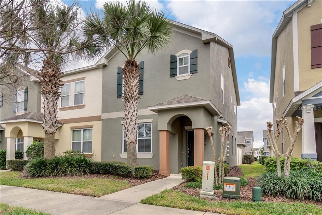 7715 Maslin Street Windermere, FL 34786 - Photo 1 of 1 a front view of a house with garden