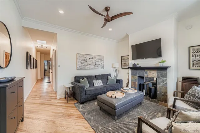 a living room with furniture and a fireplace