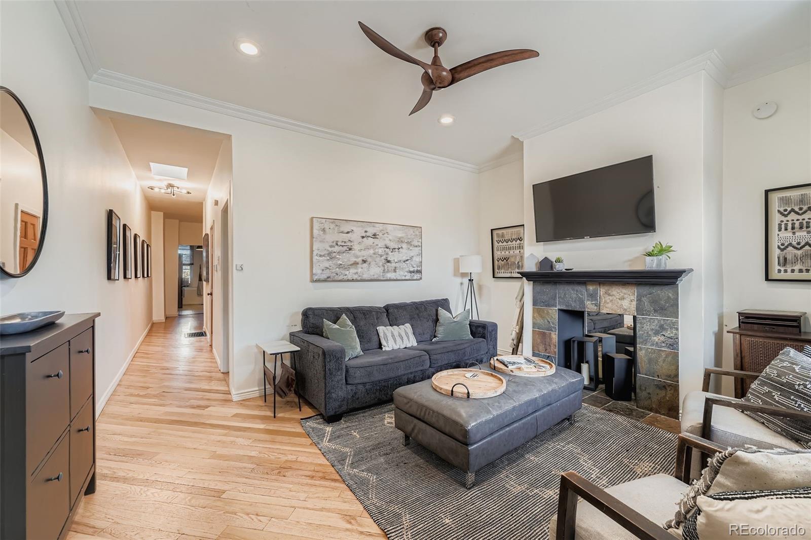 a living room with furniture and a fireplace