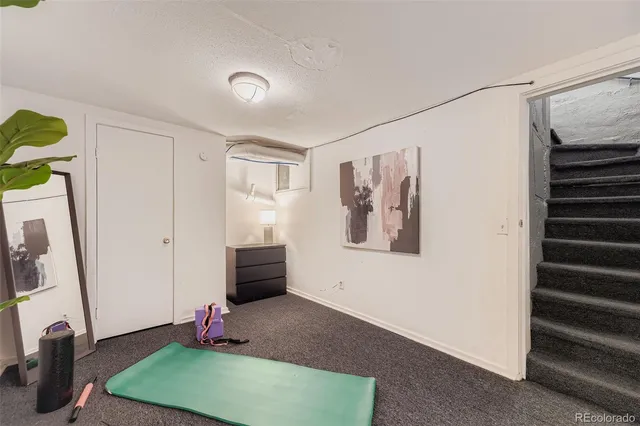 a view of a room with window and stairs