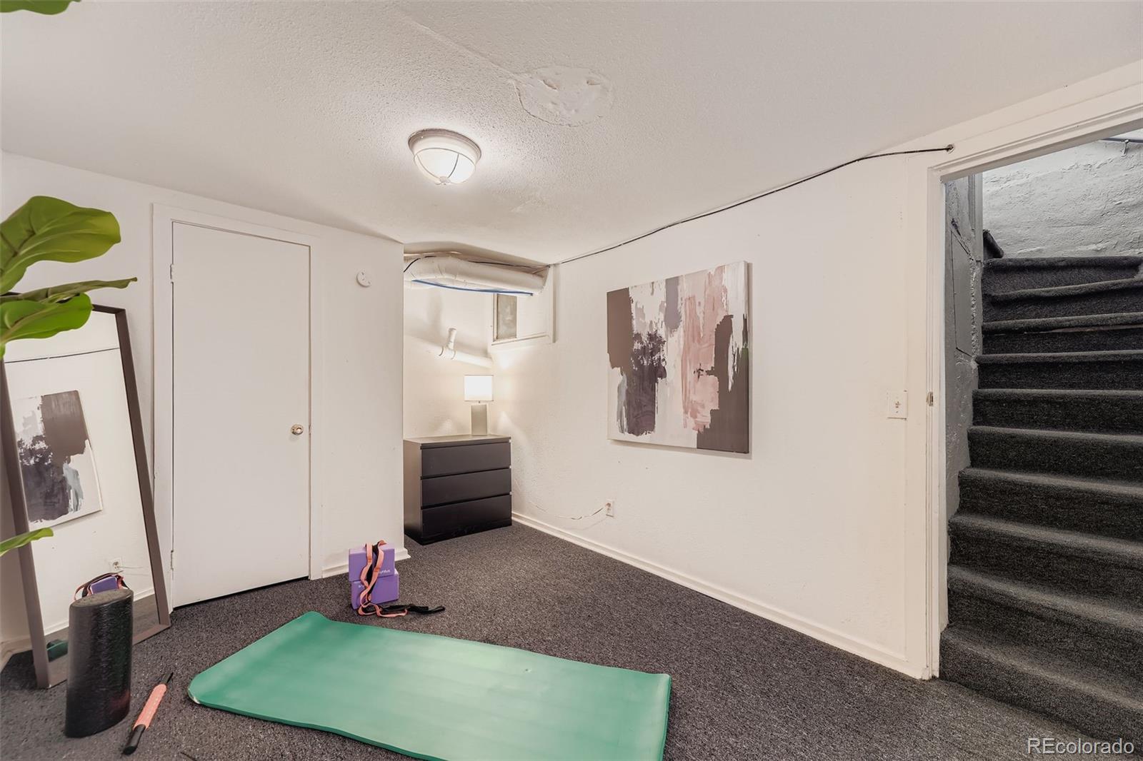 2955 Columbine Street Denver, CO 80205 - Photo 23 of 29 a view of a room with window and stairs