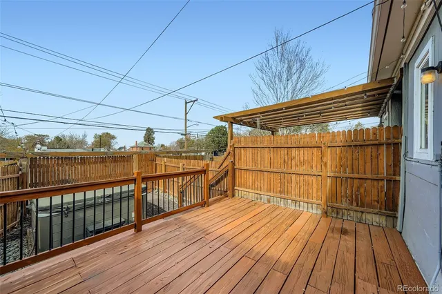 a view of a balcony with wooden floor