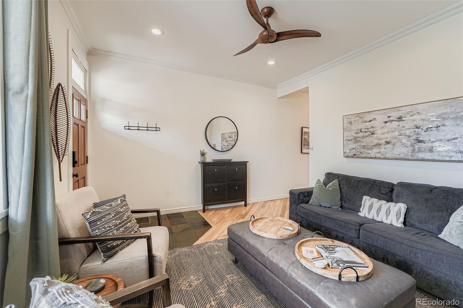 2955 Columbine Street Denver, CO 80205 - Photo 7 of 29 a living room with furniture and a flat screen tv