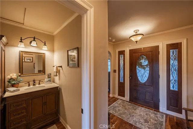 a bathroom with a sink a mirror and a shower