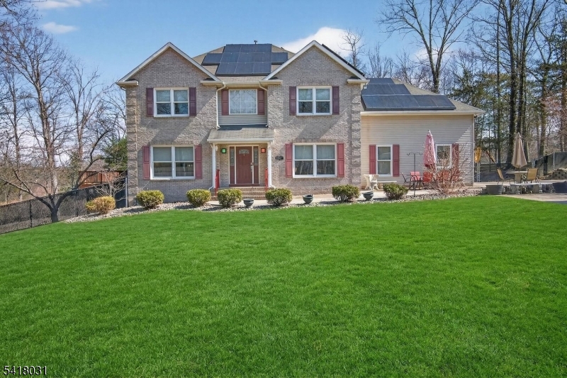 15 Hidden Valley Road Newton, NJ 07860 - Photo 1 of 45 a front view of a house with a yard patio and green space