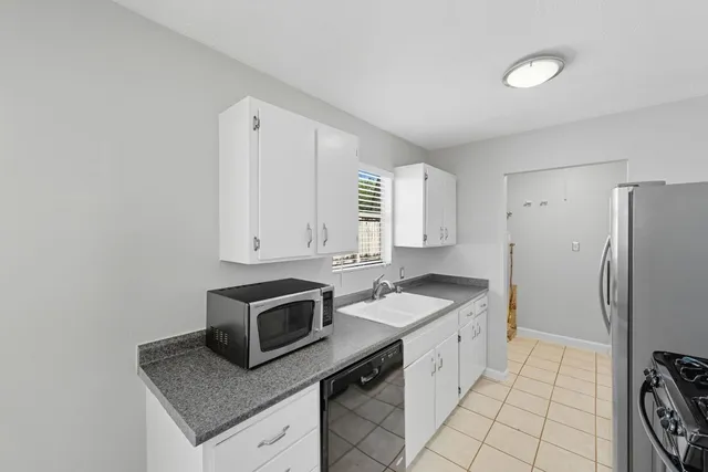 a kitchen with a stove and a refrigerator