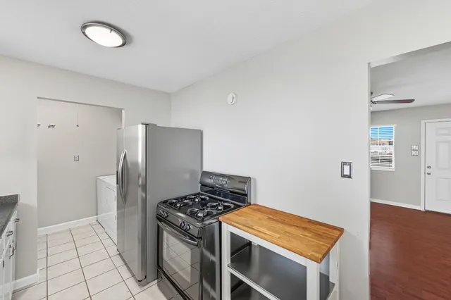 a kitchen with a sink cabinets and window