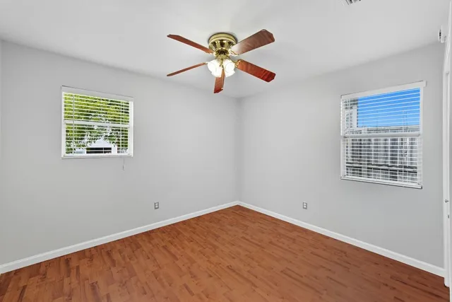 a view of balcony with wooden floor and stairs