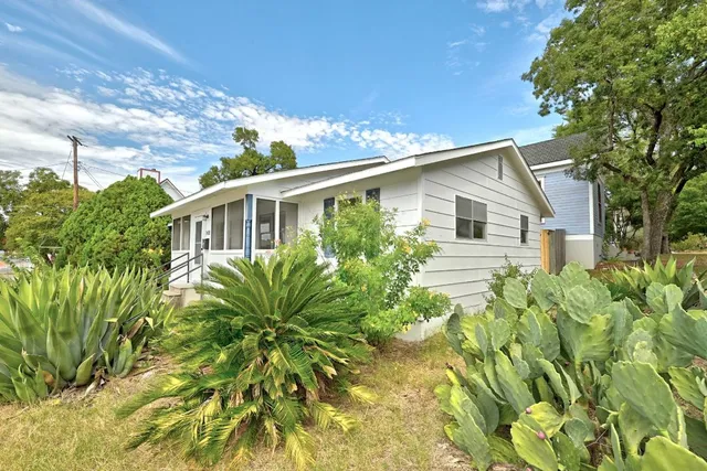 a view of a swimming pool with outdoor seating