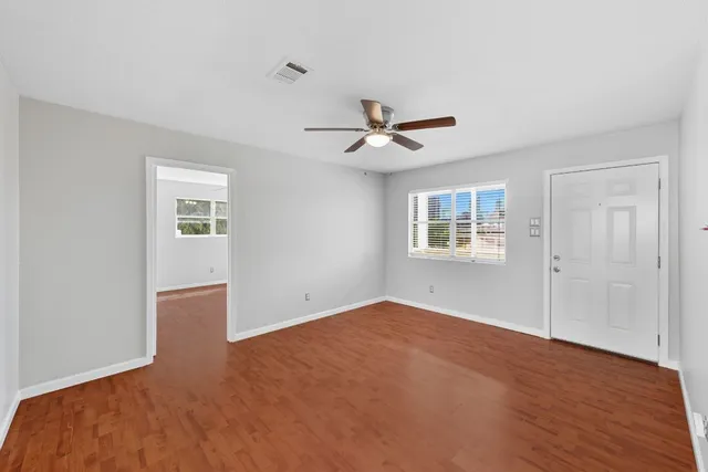 a view of empty room with windows