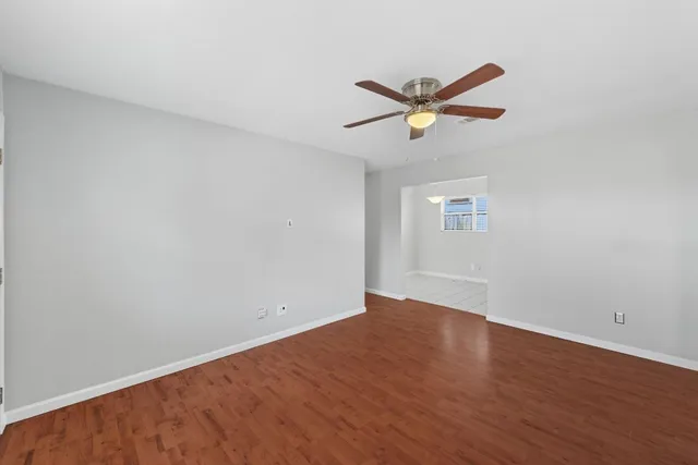 a view of an empty room with a window