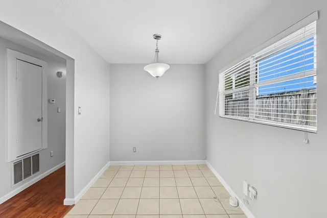 a kitchen with stainless steel appliances a refrigerator and a stove top oven