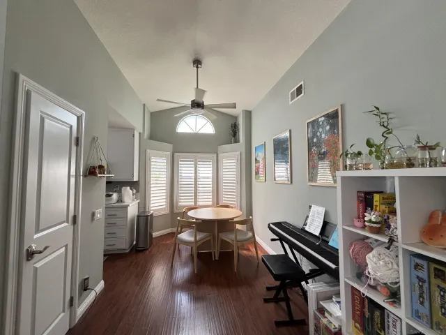 a view of a dining room with furniture window and wooden floor