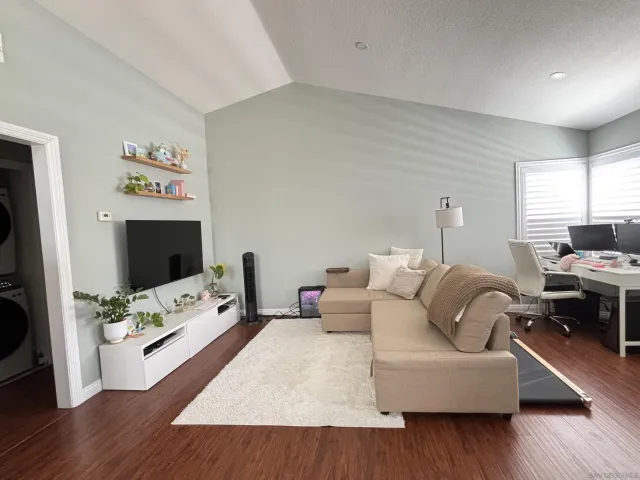 a living room with furniture fireplace and a flat screen tv