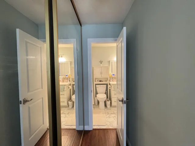 a view of a bathroom from a glass door