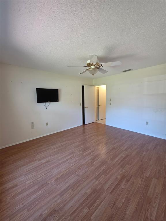 2376 Bent Pine Court Spring Hill, FL 34606 - Photo 14 of 33 a view of empty room with wooden floor