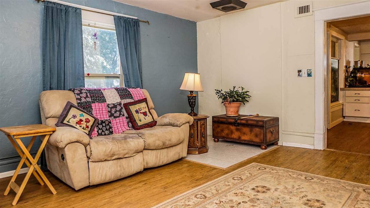 934 20 Road Fruita, CO 81521 - Photo 9 of 42 a bedroom with a bed and wooden floor