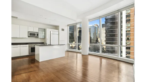 a large kitchen with granite countertop a stove a sink and a granite counter tops