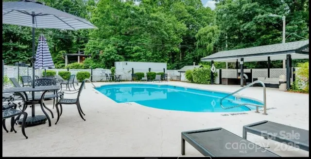 a view of a swimming pool with a patio