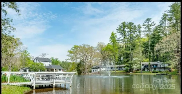 a view of a lake with a house in the background