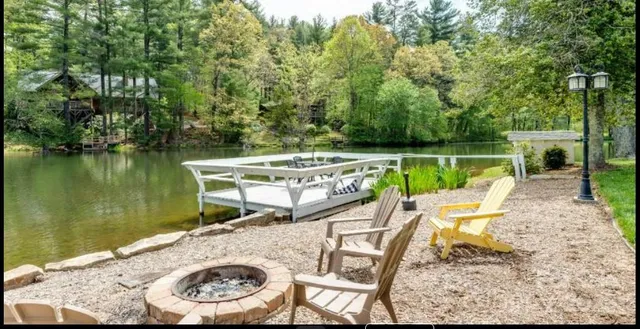 a view of a swimming pool with chairs in patio