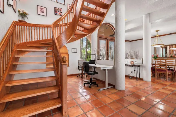 a view of entryway wih livingroom and stairs