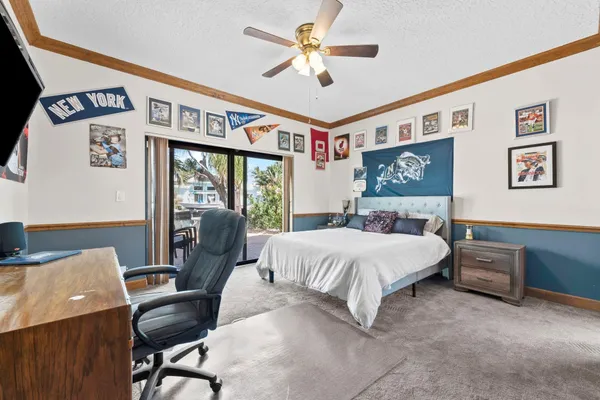 a spacious bedroom with a bed and a desk