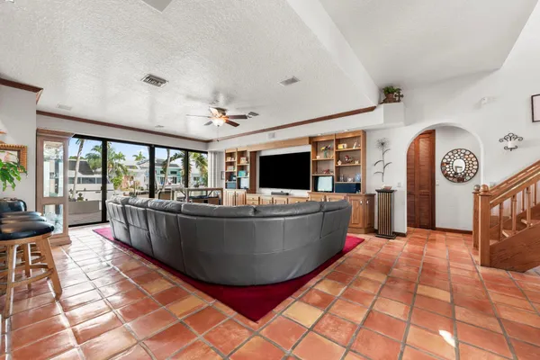 a living room with large furniture and a large window