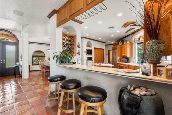 a kitchen with a table and chairs